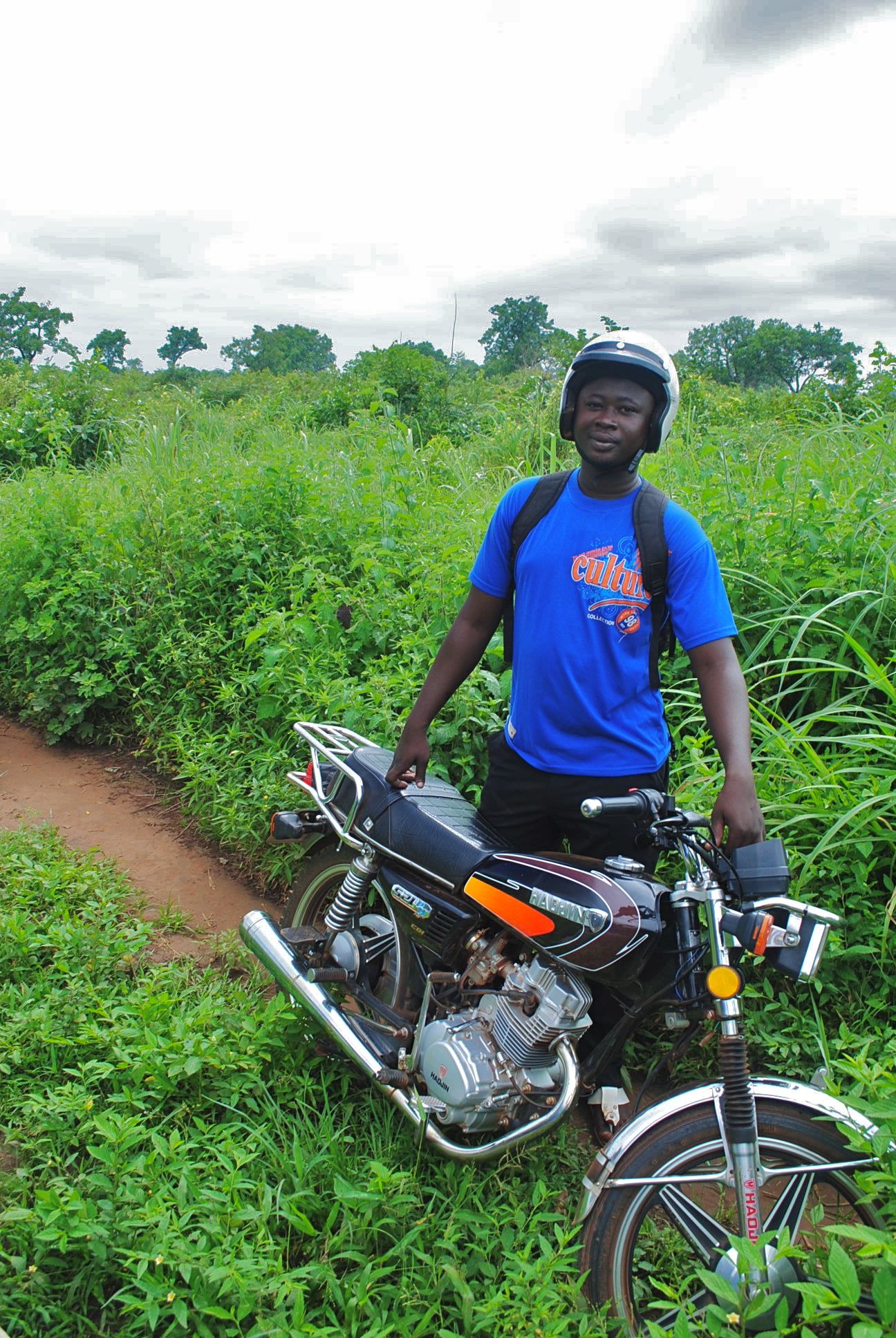 Where would we be without our motos? CWS staffer TJ poses for a picture.