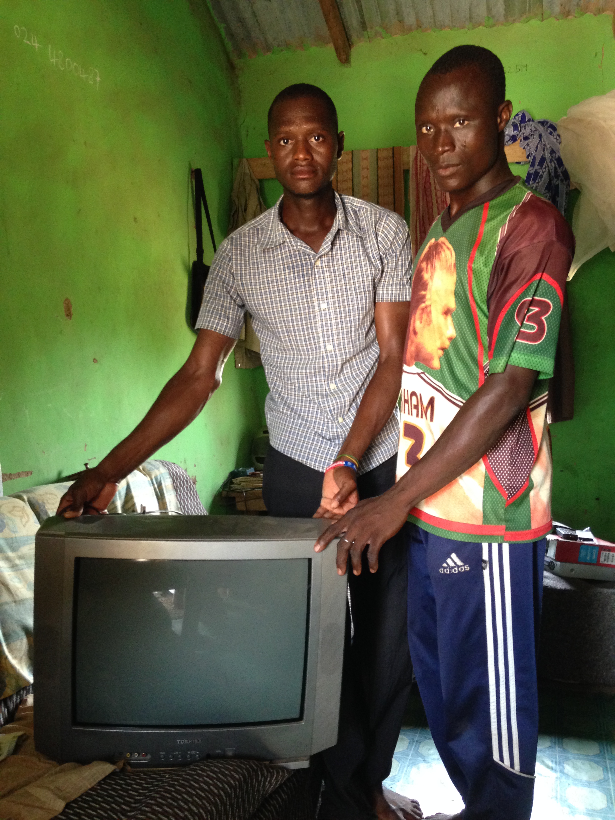 Some people own a tv in a village with no electricity.