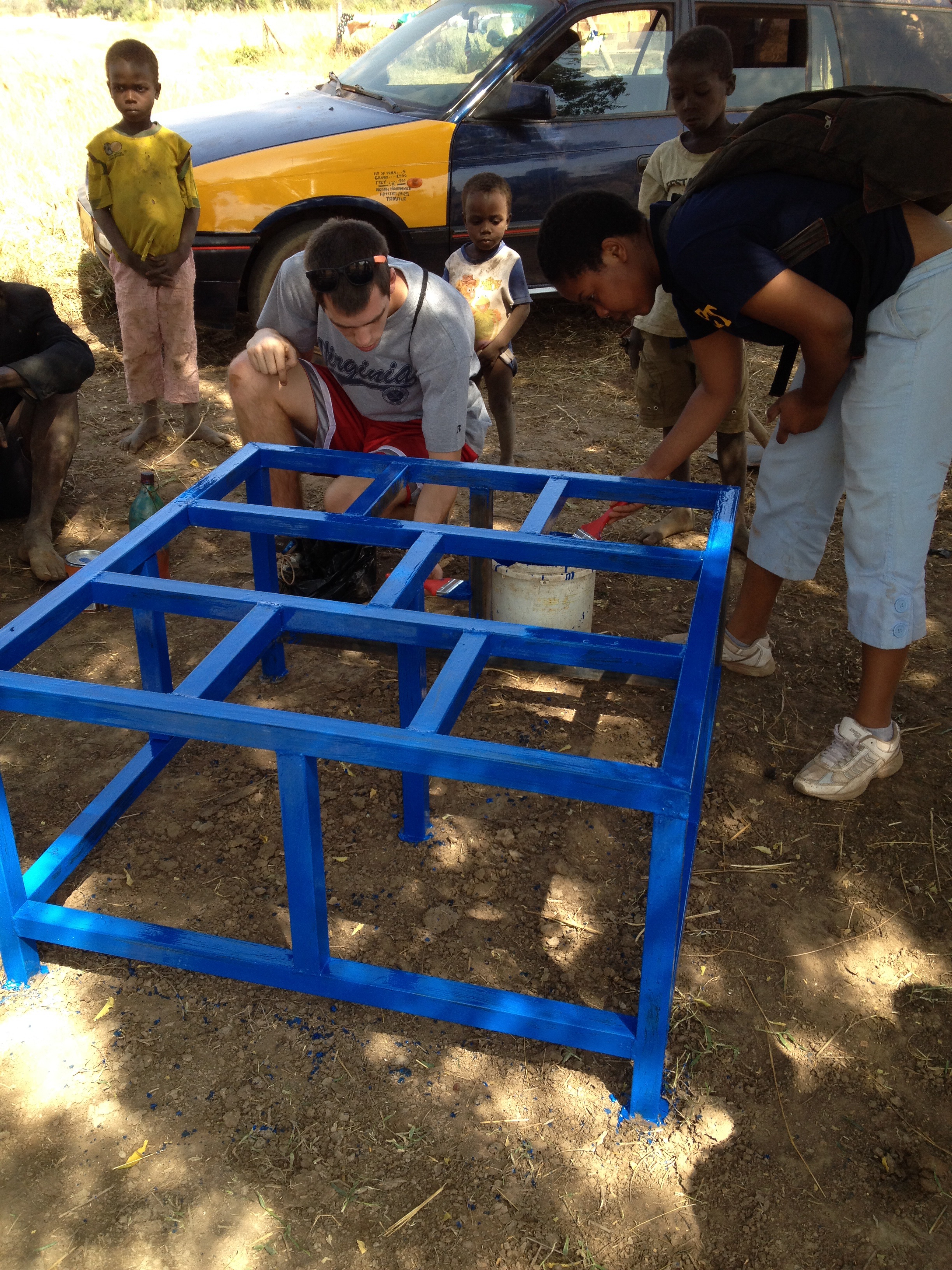JImmy and Miriam paint the new polytank stand