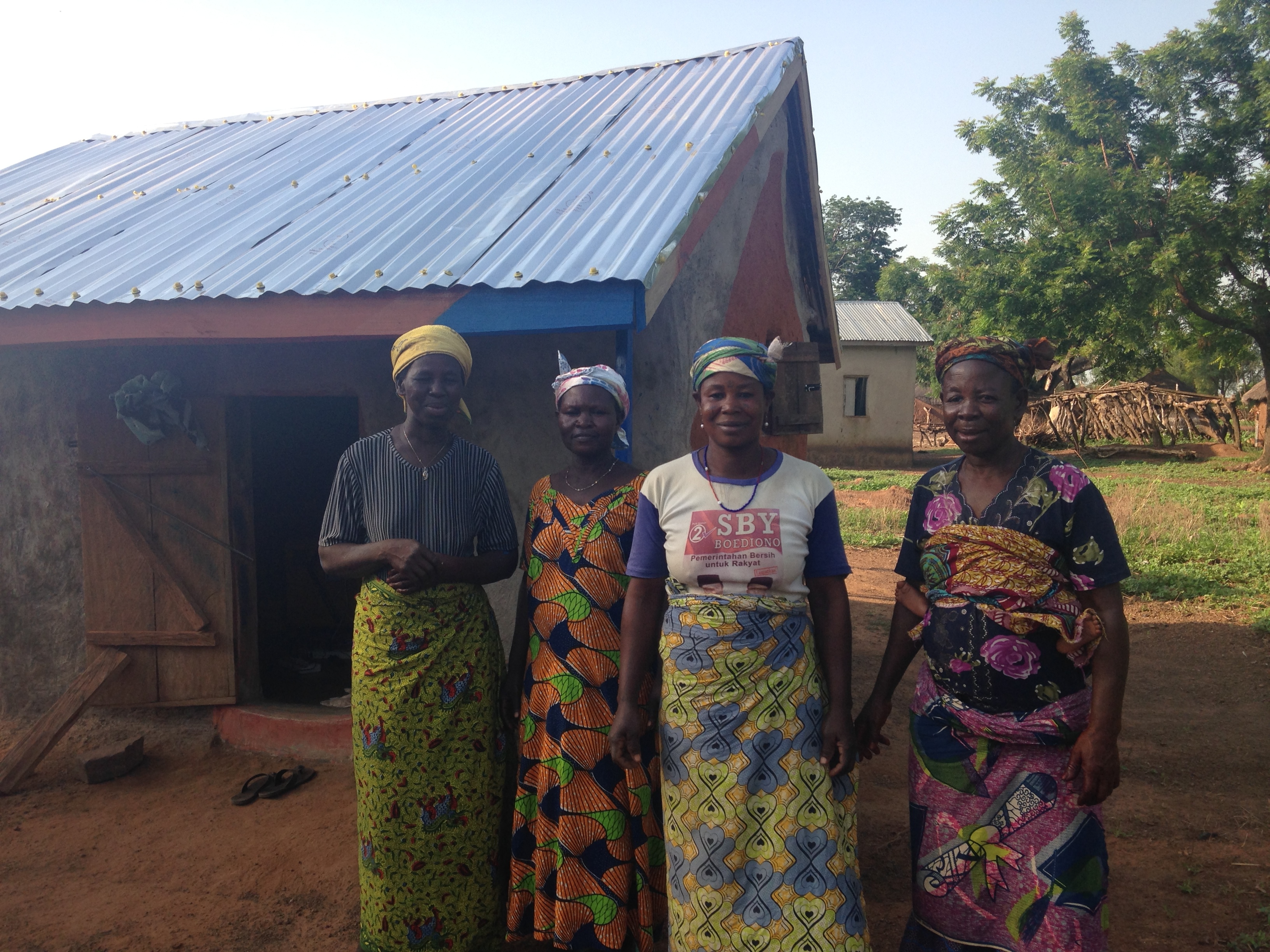 Saramatu, Damu, Lydia and Fuseina posing by the solar business after their first week of sales