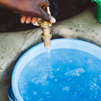 Tap flowing with Safe Water